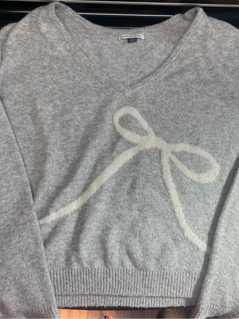 American Eagle Outfitters Light Gray V-Neck Sweater with Cream Bow